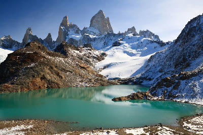 Laguna de los Tres glacial lake with turquoise water and Mount Fitz Roy peaks rising behind it in Patagonia, Argentina.
