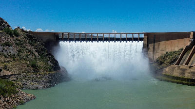 Water flowing over the spillway of Gariep Dam during a controlled release in South Africa.