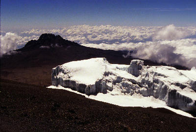 Summit glaciers on Mount Kilimanjaro with Mawenzi Peak beyond the Saddle, viewed from approximately 5,700 metres above sea level in Tanzania.
