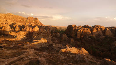 Golden sunset light across layered sandstone formations in Isalo National Park, Madagascar