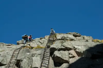 Hikers ascending the Chain Ladders on the Sentinel Route leading to Tugela Falls and the Amphitheatre in the Drakensberg, South Africa.