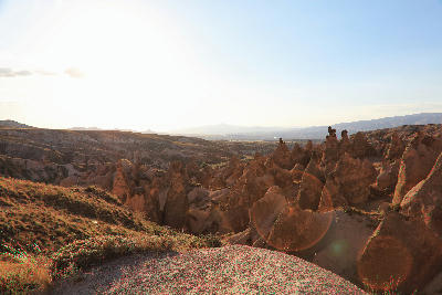 Fairy chimneys and eroded volcanic rock formations at sunset in Devrent Valley, Cappadocia, Turkey.