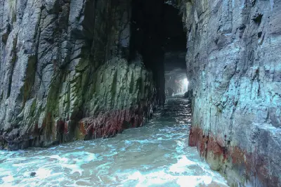 Seawater flowing through the narrow natural rock tunnel inside Remarkable Cave, Tasmania.