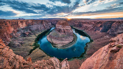 Horseshoe Bend sunset backlit Colorado River full curve dramatic sky Page Arizona landscape photography