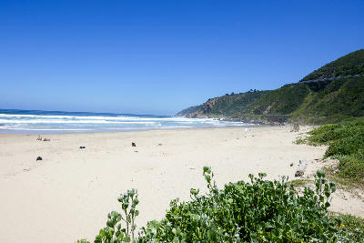 Wide sandy beach and rolling surf at Wilderness Beach near Kaaimans Pass on the Garden Route.