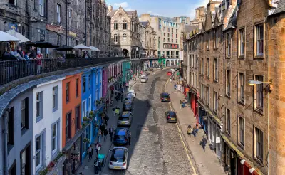 Victoria Street in Edinburgh with colourful buildings seen from George IV Bridge.