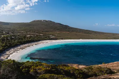 Elevated view across the white sand and turquoise water of Lucky Bay in Cape Le Grand National Park, Western Australia.