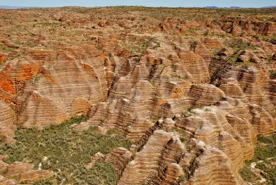 Vast field of distinctive striped sandstone domes and deeply eroded valleys across the Bungle Bungle Range in the Kimberley.