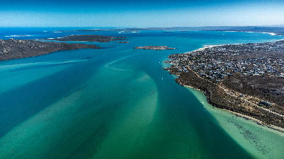 Aerial view of Langebaan Lagoon showing turquoise waters, sandbanks, islands and the West Coast coastline in South Africa.