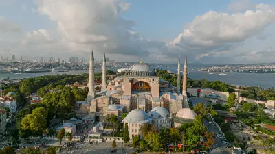 Aerial view of Hagia Sophia with the Bosphorus and Istanbul skyline in the background.