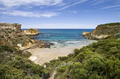 View over Childers Cove with sandy beach, limestone cliffs and turquoise water in Bay of Islands Coastal Park, Victoria.