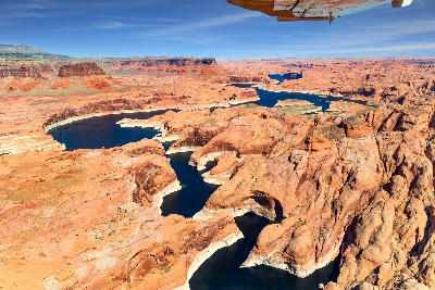 Aerial view Lake Powell canyon system low water levels exposed sandstone reservoir Page Arizona Colorado River