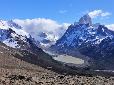 High viewpoint from Loma del Pliegue Tumbado showing Laguna Torre and surrounding mountains in El Chaltén, Patagonia.