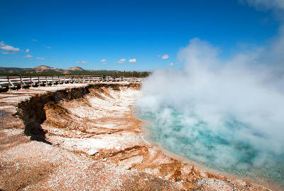 Excelsior Geyser Crater Yellowstone Midway Basin steaming blue pool boardwalk Wyoming