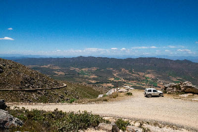 High mountain gravel road and valley viewpoint on Swartberg Pass in the Klein Karoo of South Africa.