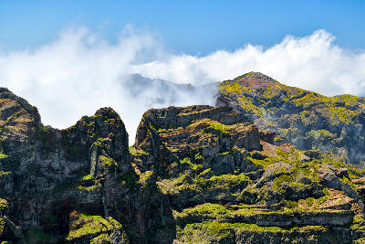 Rocky mountain landscape along the Vereda do Areeiro hiking trail in Madeira, Portugal.