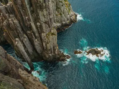 Sheer dolerite columns plunge into the Tasman Sea beneath the cliffs of Cape Hauy in southeast Tasmania.