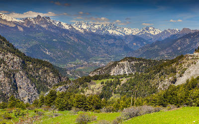 Valley landscape with distant Barre des Écrins in the French Alps